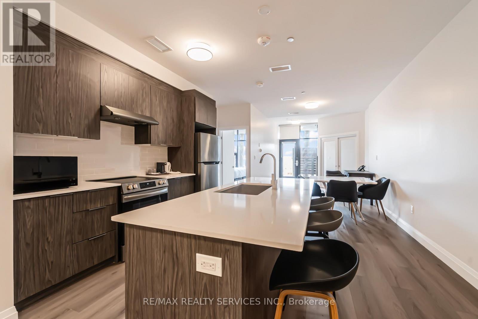 #8 - 30 Dean Park Road, Toronto, ON - Indoor Photo Showing Kitchen With Upgraded Kitchen