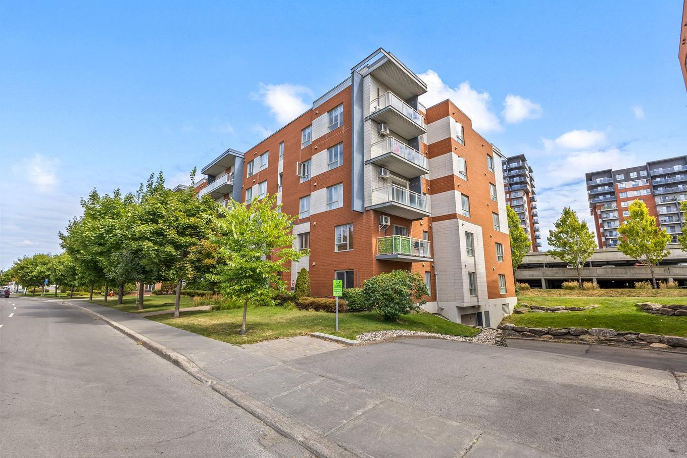 Façade - 301-1445 Boul. Le Corbusier, Laval (Laval-Des-Rapides), QC - Outdoor With Balcony With Facade
