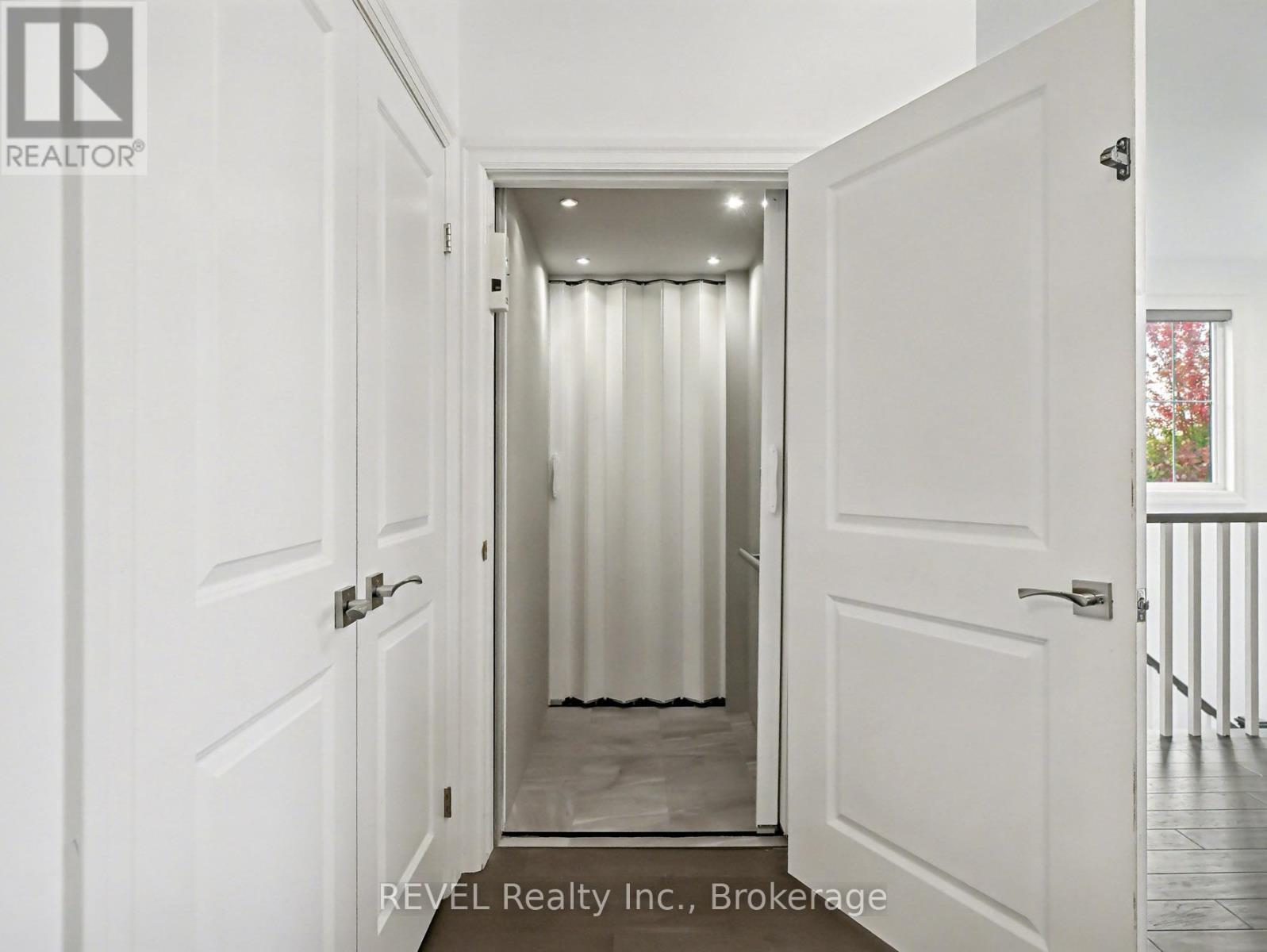 Door to Elevator - A7 - 7 Aberdeen Lane S, Niagara-On-The-Lake (Town), ON - Indoor Photo Showing Other Room