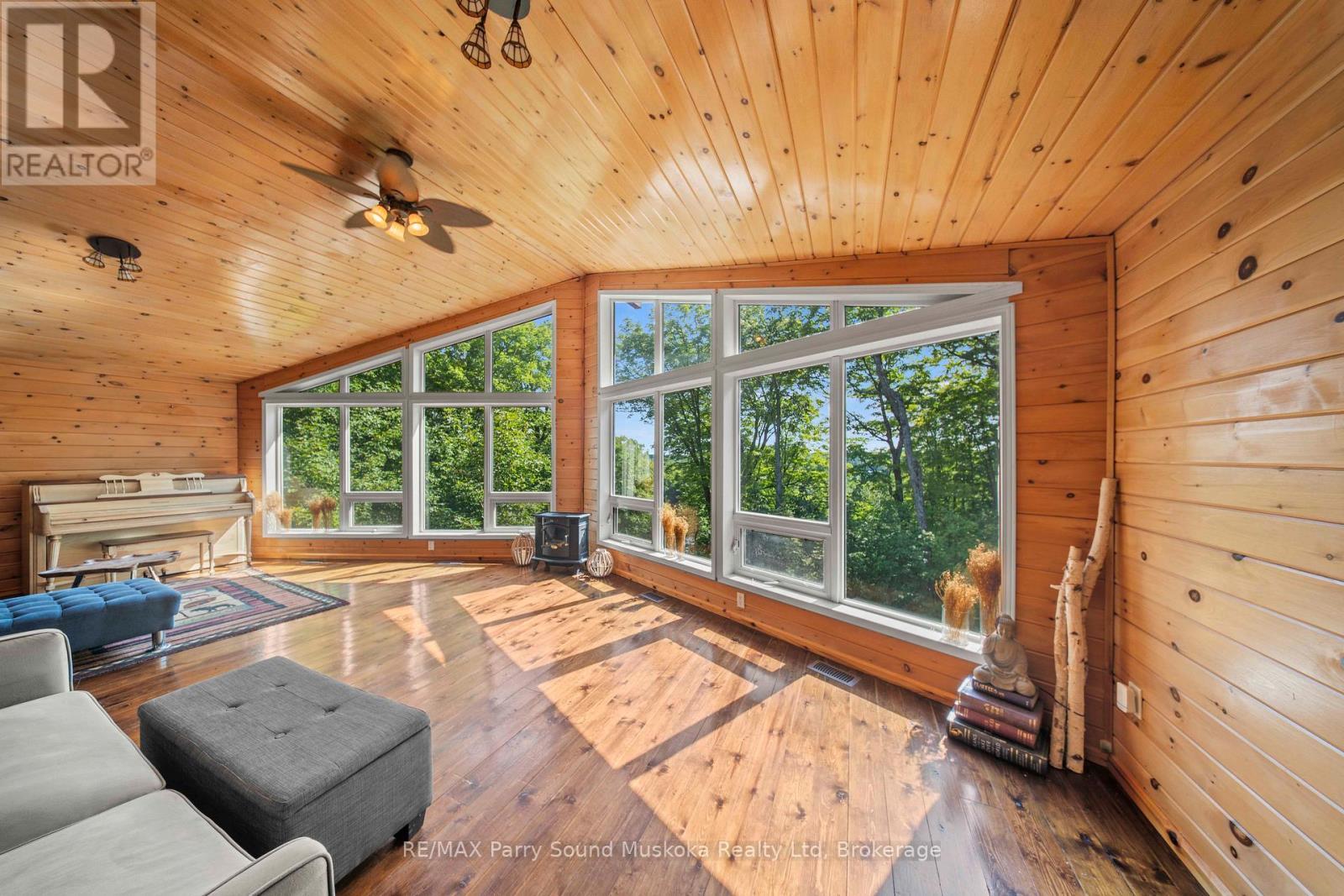 23 Shady Maple Trail, Whitestone, ON - Indoor With Fireplace