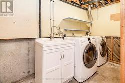Basement laundry, utility & storage area -