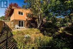 Fenced private yard with mature trees & gardens -