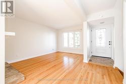 Foyer with powder room opens to living room -