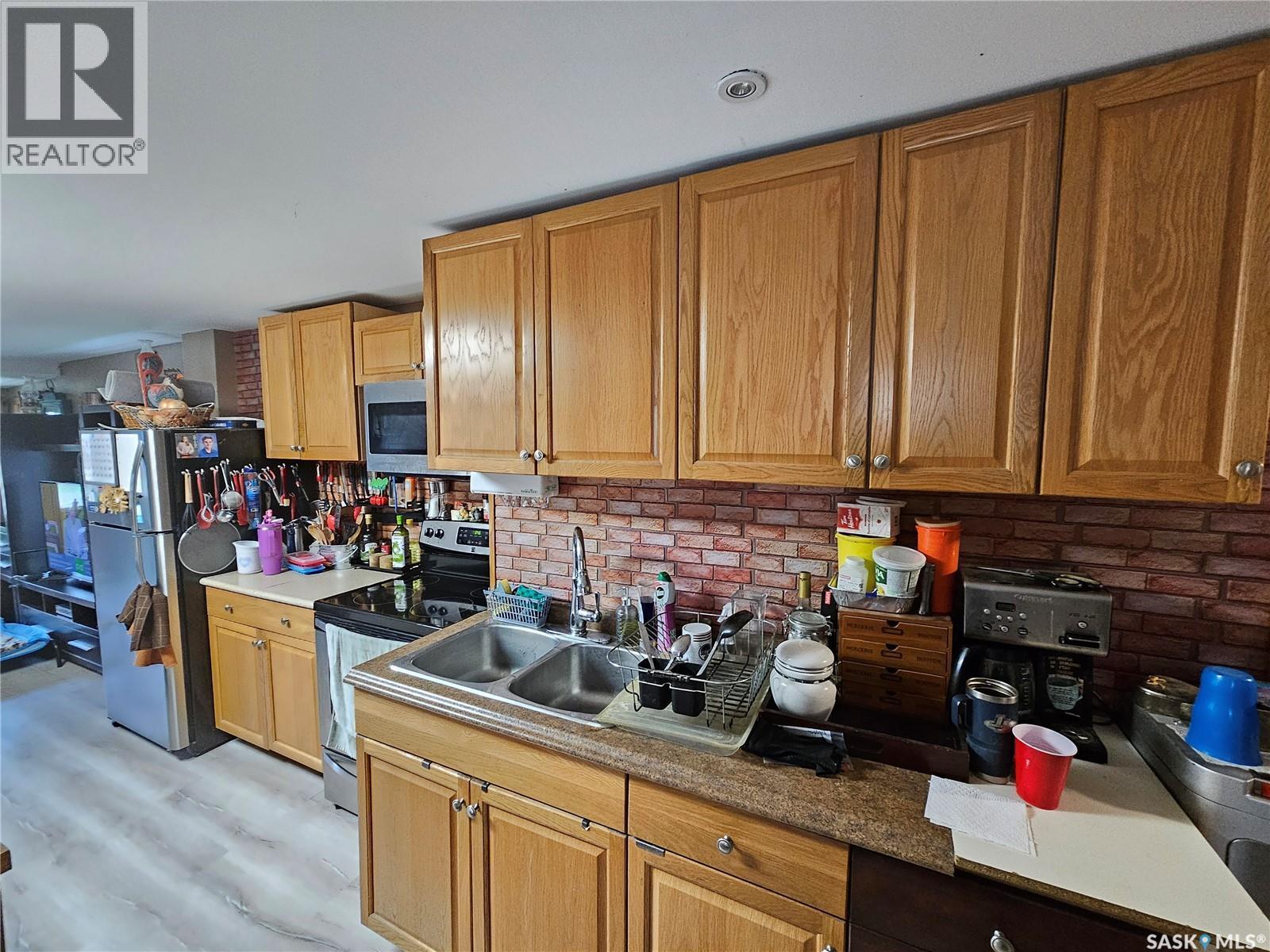 107 Carlyle Street, Arcola, SK - Indoor Photo Showing Kitchen With Double Sink