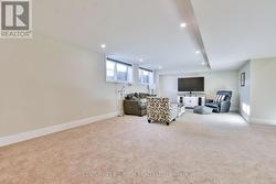 Huge rec room with large above grade windows. -