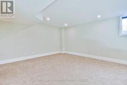 Tons of room in this bright lower level rec room. -