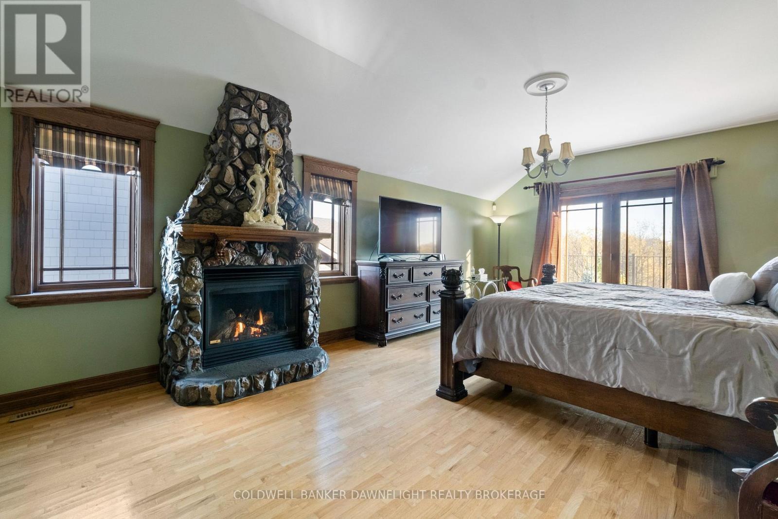 246 Hazelton Lane, South Huron (Exeter), ON - Indoor Photo Showing Bedroom With Fireplace