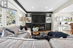 Accent Wall with Fireplace and Picture Lights. -