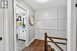 Upstairs Hallway with Wainscoting Accent Wall. -