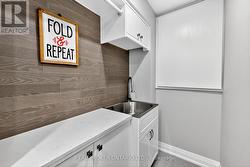 Laundry Room with Crawl Space & Utility Sink. -
