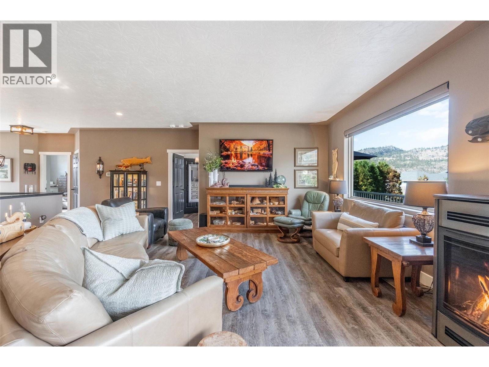 6963 Chardonnay Place, Oliver, BC - Indoor Photo Showing Living Room With Fireplace