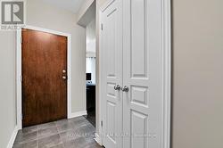 Large double closet in tiled foyer -