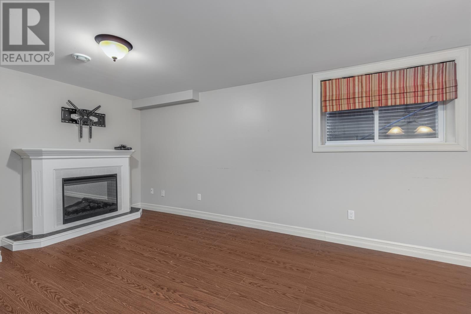 23 Tamarack Drive, Witless Bay, NL - Indoor Photo Showing Other Room With Fireplace