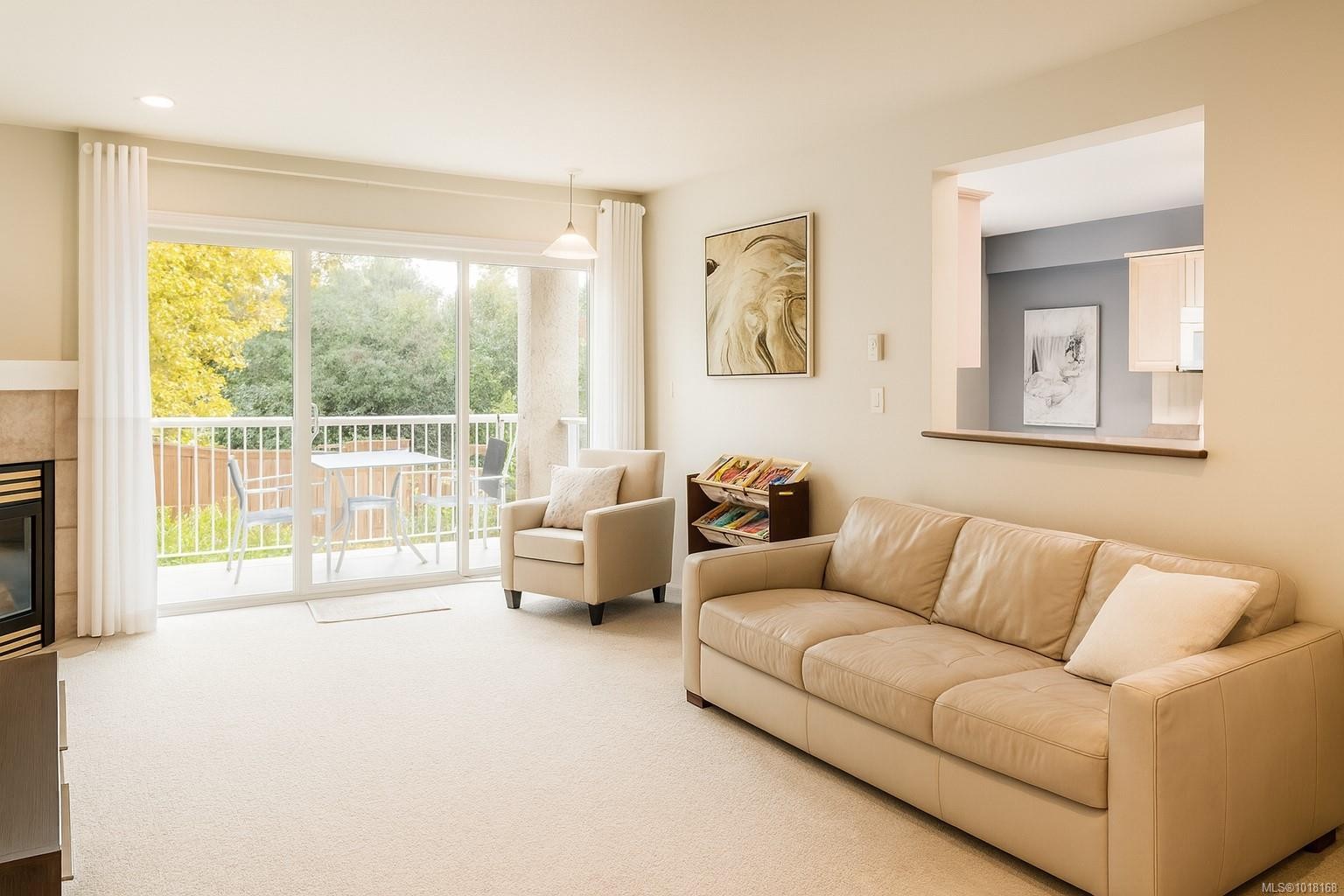 204-1240 Verdier Ave, Central Saanich, BC - Indoor Photo Showing Living Room With Fireplace