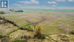Aerial view from west before corn planted. -