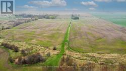 Aerial view from south before corn planted. -