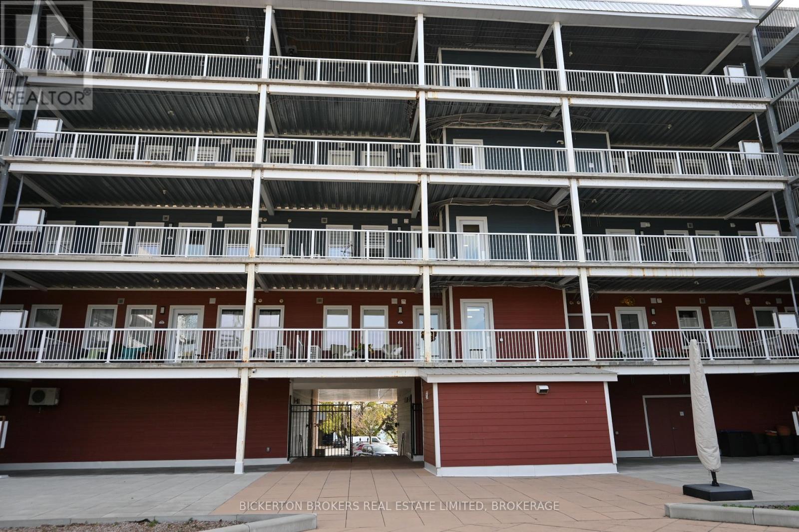 207 - 130 Water Street, Gananoque, ON - Outdoor With Balcony With Facade