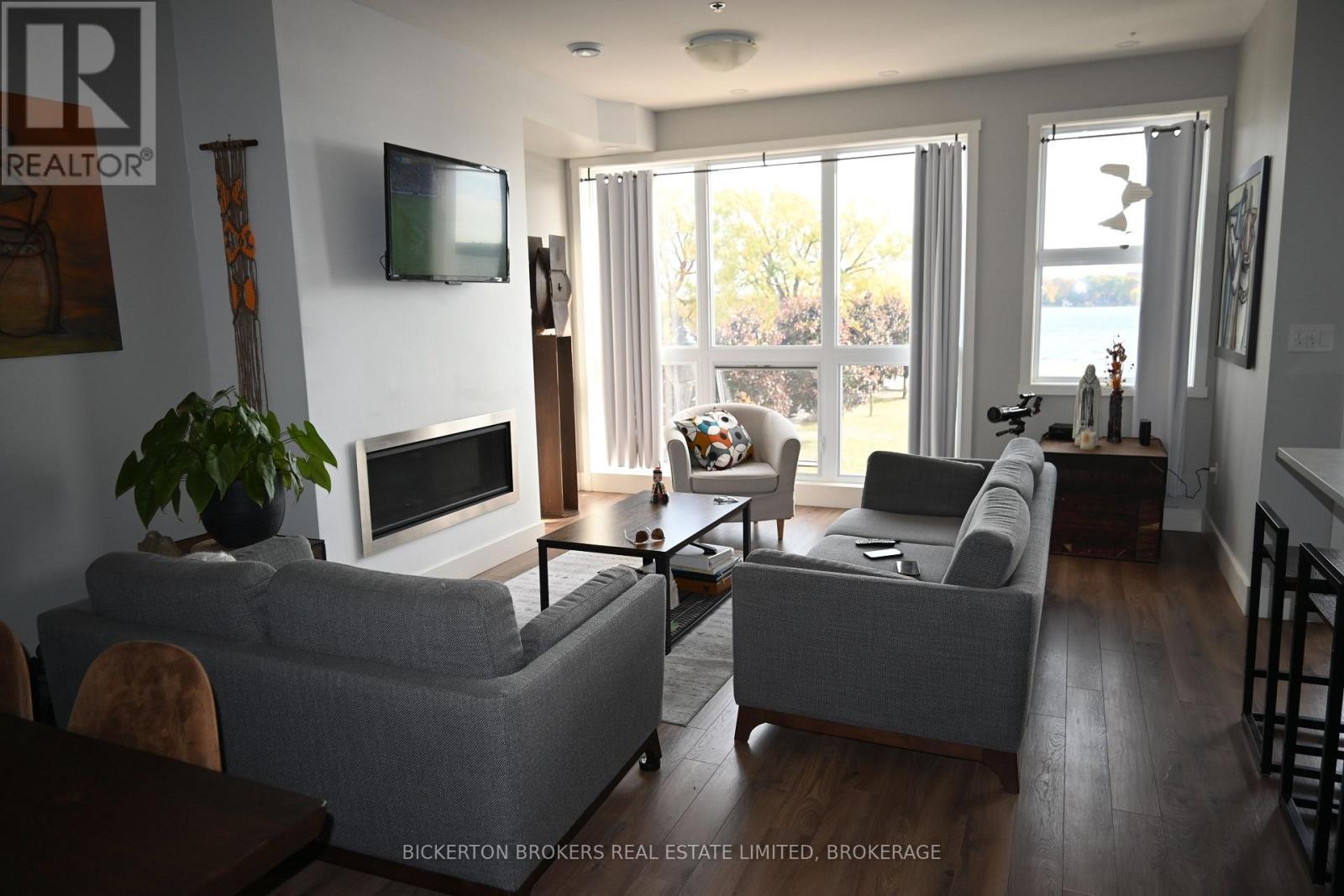 207 - 130 Water Street, Gananoque, ON - Indoor Photo Showing Living Room With Fireplace