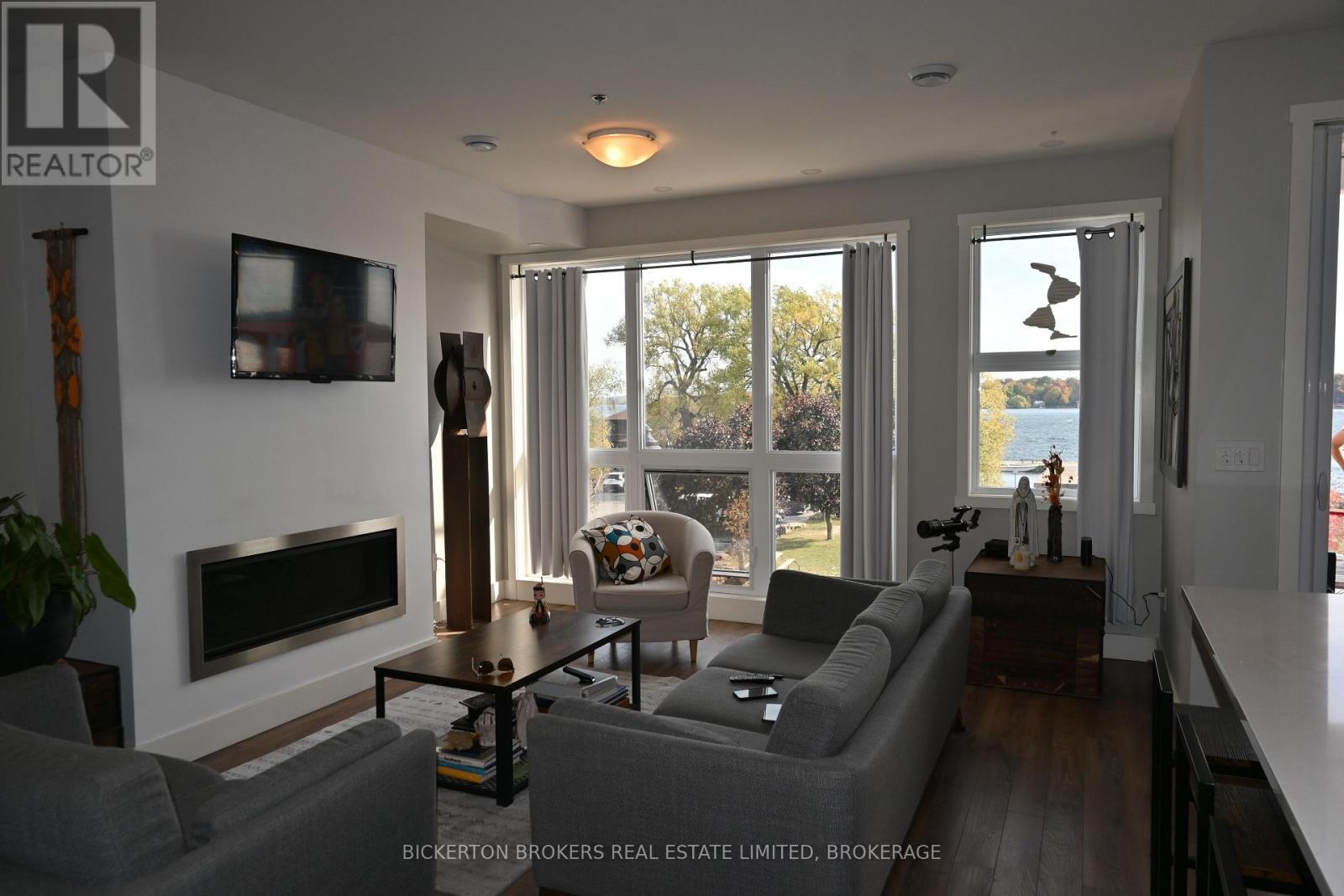 207 - 130 Water Street, Gananoque, ON - Indoor Photo Showing Living Room With Fireplace