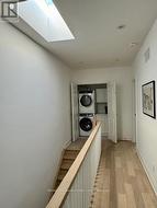 Upstairs hallway with Laundry and a skylight -