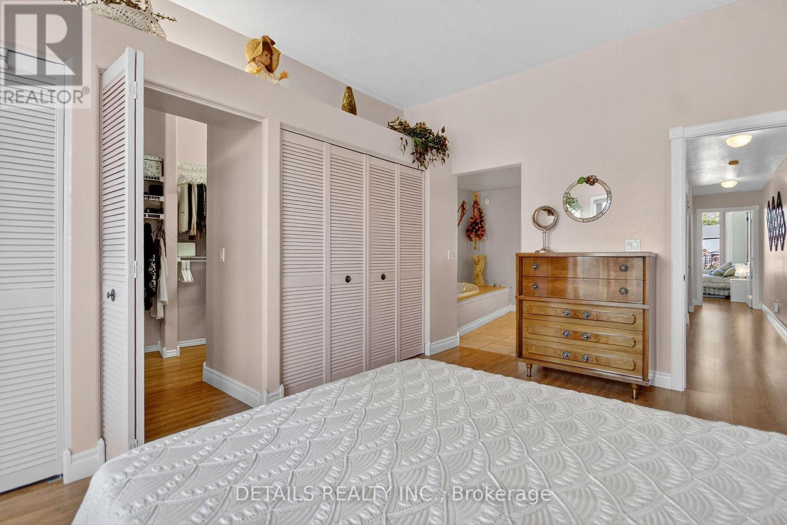 Closet doors open to an amazing Walk-in Closet - 7 Eagle Chase Court, Ottawa, ON - Indoor Photo Showing Bedroom