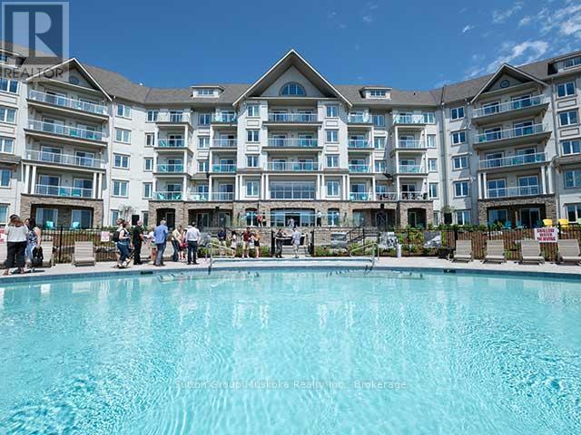 423 - 25 Pen Lake Point Road, Huntsville (Chaffey), ON - Outdoor With In Ground Pool With Balcony With Facade