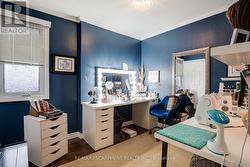 3rd main floor bedroom, used as make up area. -