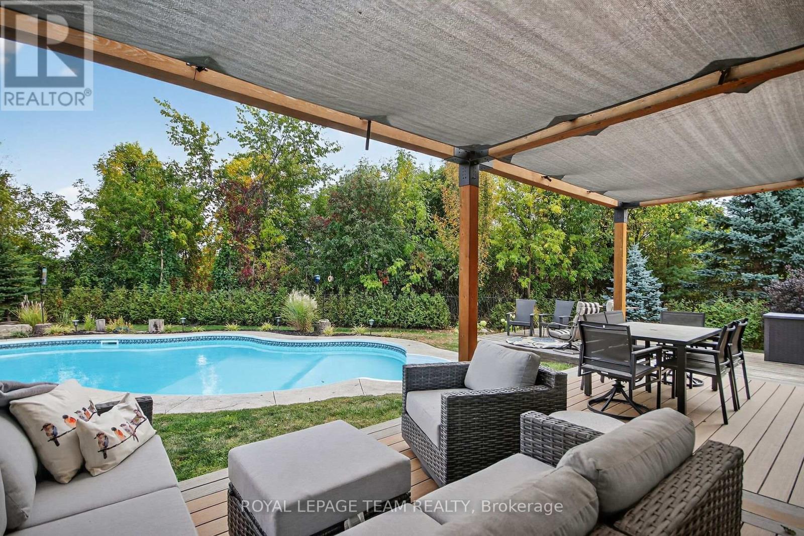 128 Chenoa Way, Ottawa, ON - Outdoor With In Ground Pool With Deck Patio Veranda