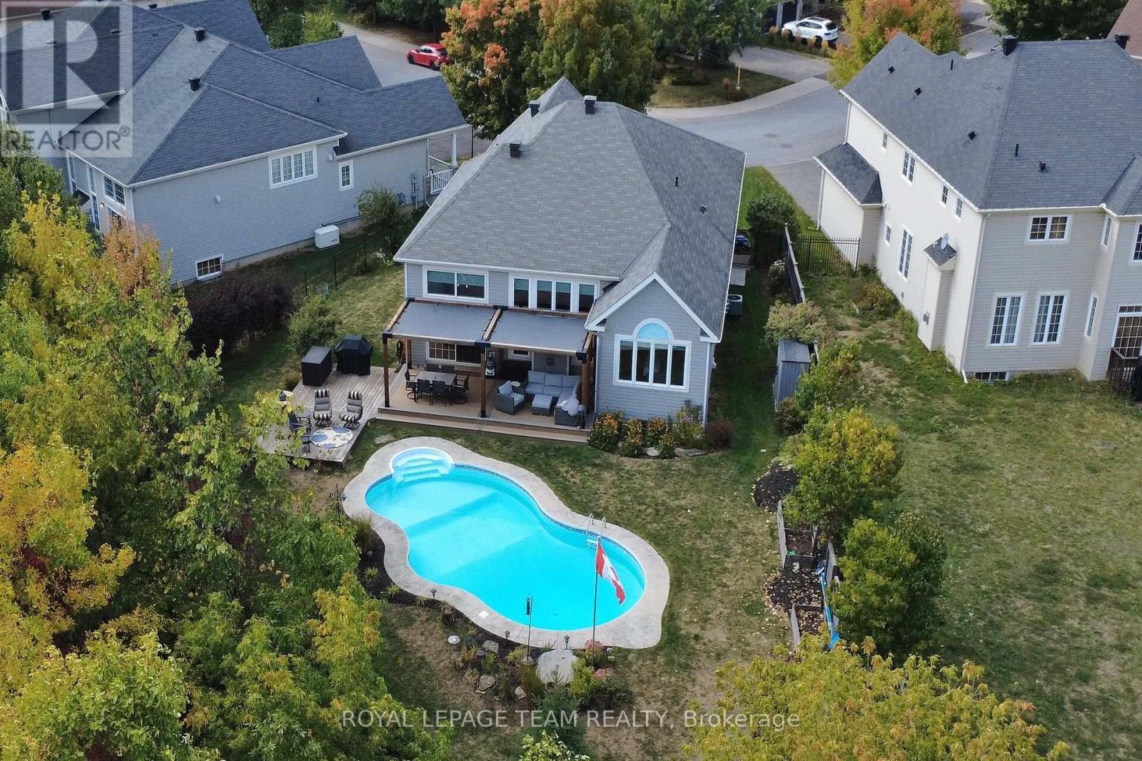 128 Chenoa Way, Ottawa, ON - Outdoor With In Ground Pool With Deck Patio Veranda