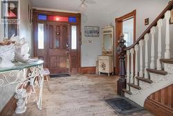 Front Foyer. Door to Dining Room, right. -