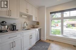 Butler's pantry with sink, fridge and storage! -