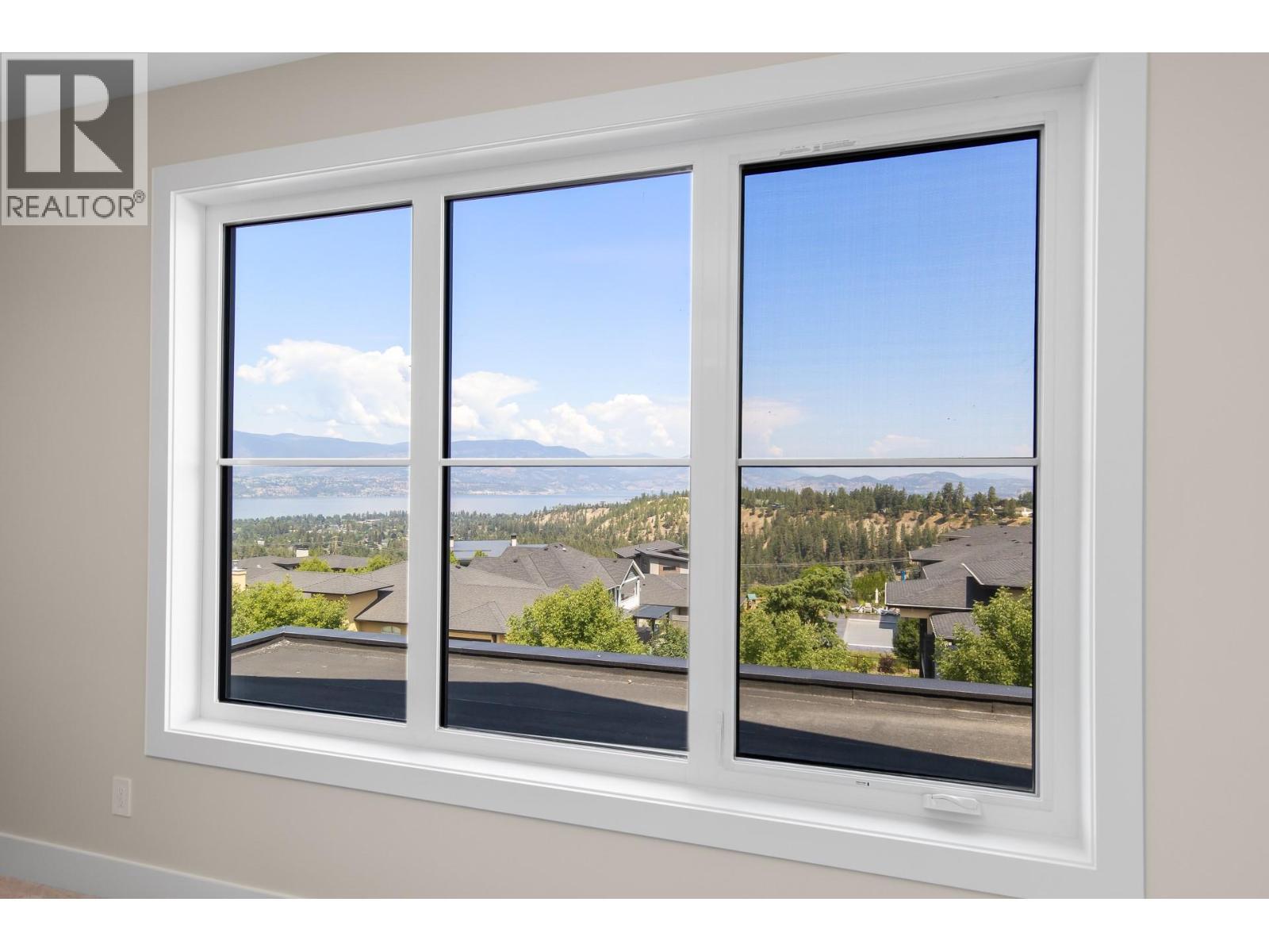 Primary bedroom views - 4964 Bucktail Lane, Kelowna, BC - Indoor Photo Showing Other Room