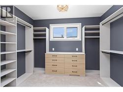 Primary bedroom walk in closet -