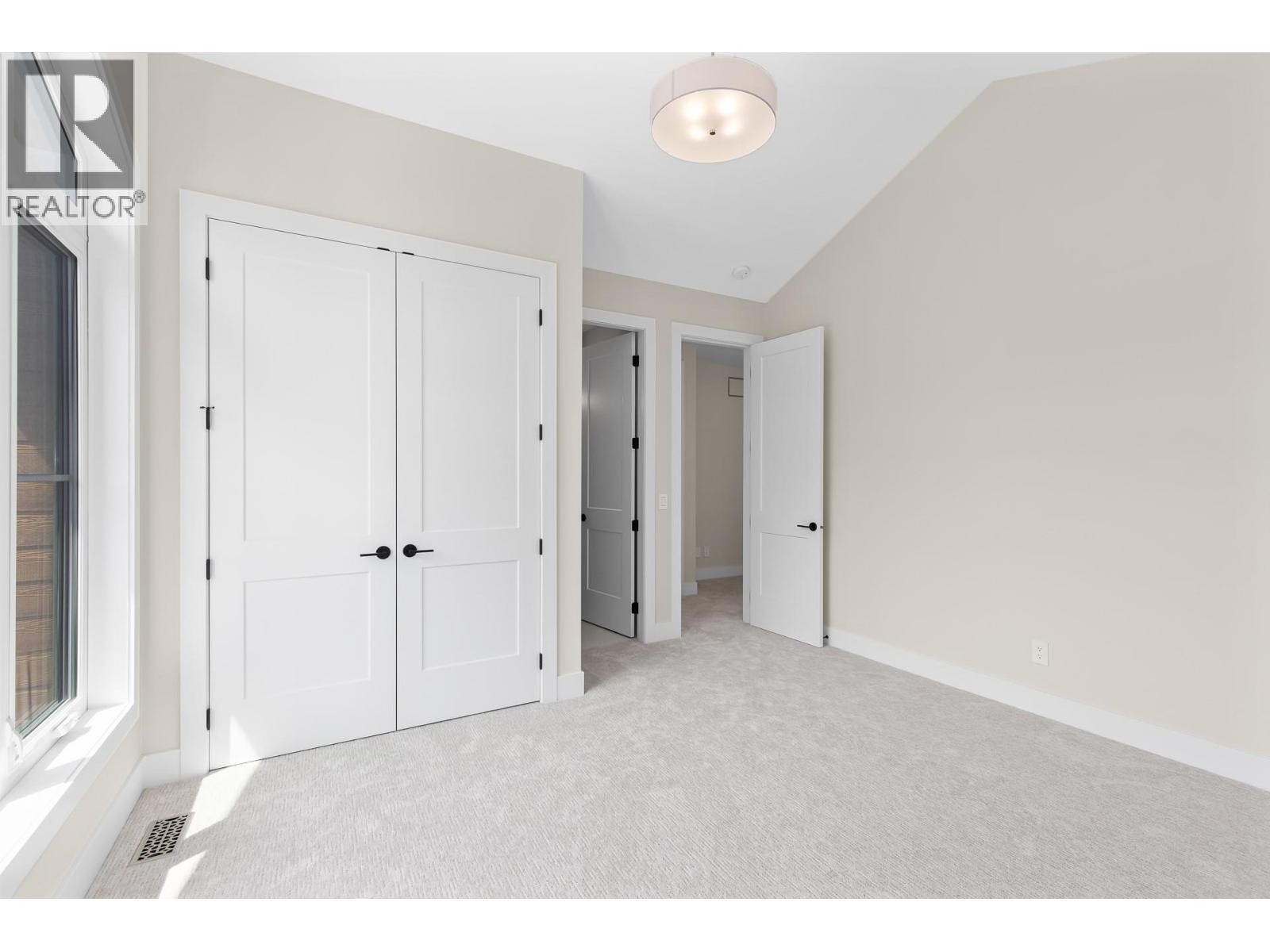 Upper level bedroom - 4964 Bucktail Lane, Kelowna, BC - Indoor Photo Showing Other Room