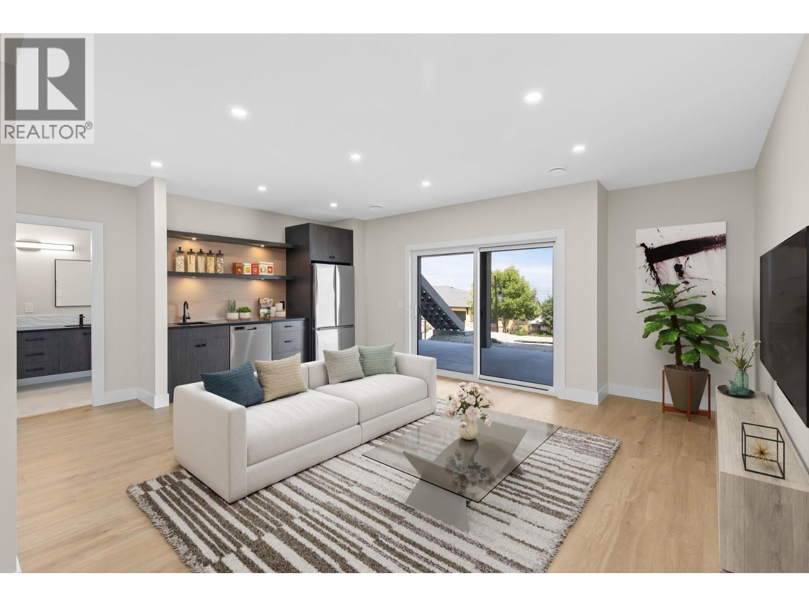 Lower level rec room - Virtually staged - 4964 Bucktail Lane, Kelowna, BC - Indoor Photo Showing Living Room