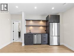 Wet bar in lower level rec room. -