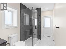 Lower level washroom with double vanity with access to backyard for future pool. -