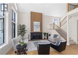 Large open living room with slat wall fireplace -