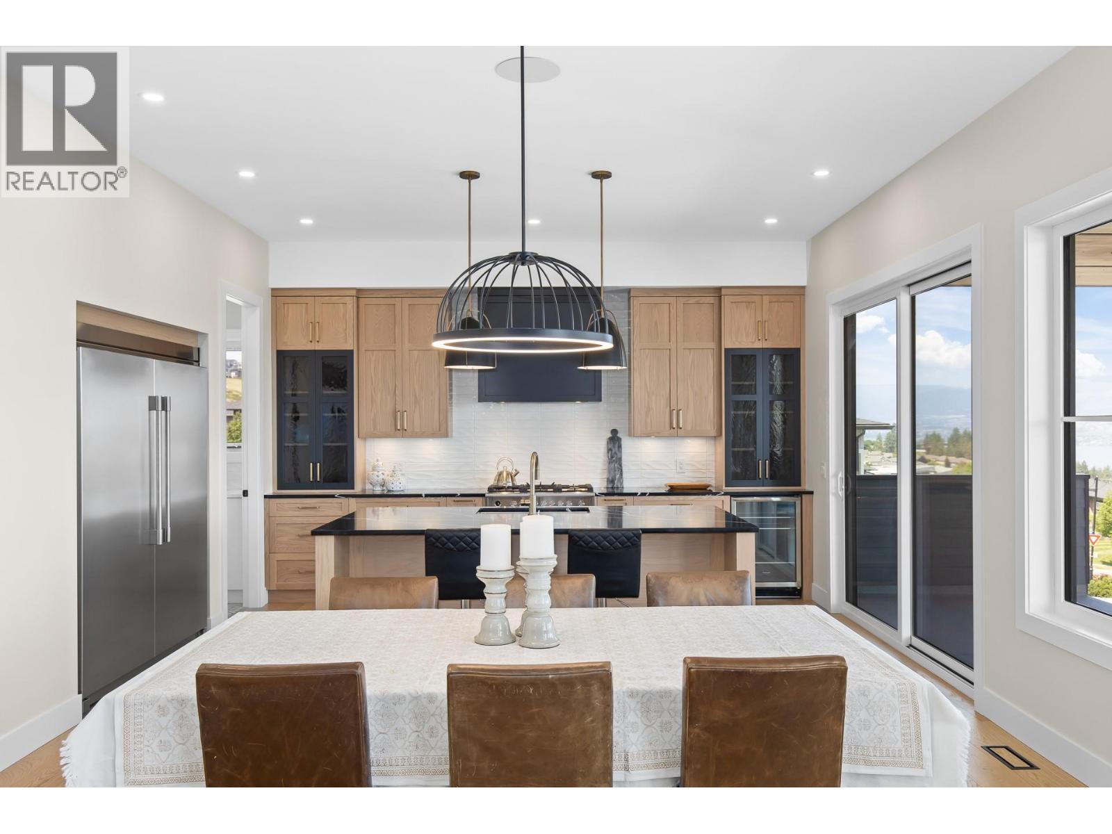 Open style living, dining and kitchen. - 4964 Bucktail Lane, Kelowna, BC - Indoor