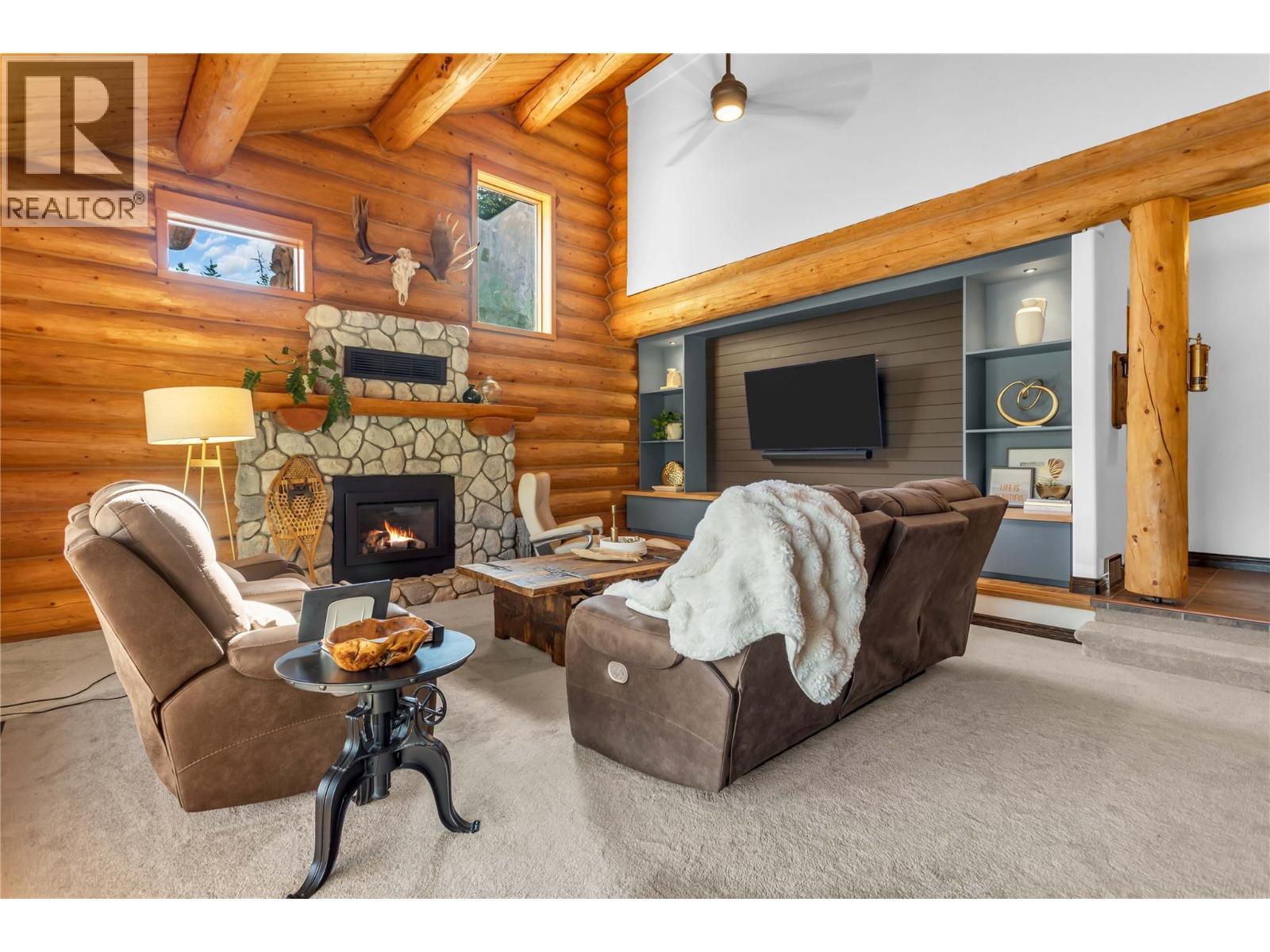 5738 Goudie Road, Kelowna, BC - Indoor Photo Showing Living Room With Fireplace