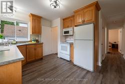 Kitchen w stairs to basement & side door -