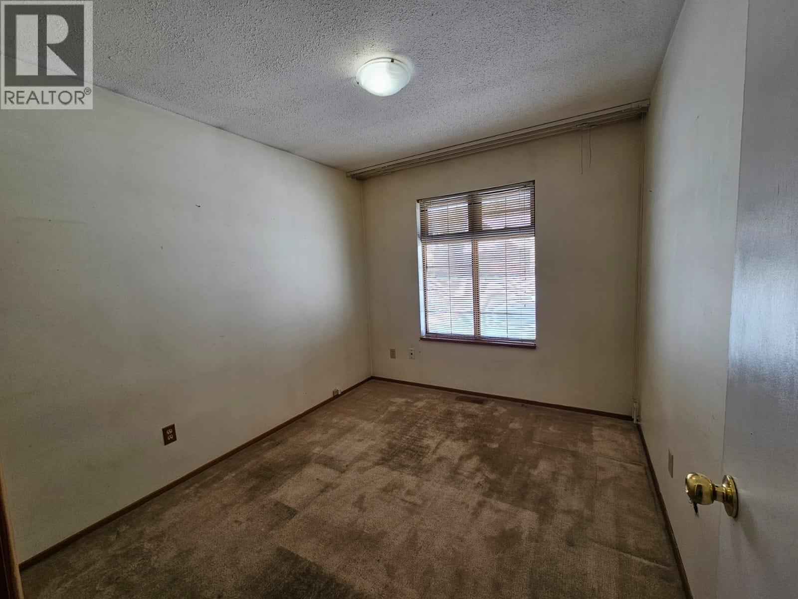 128 Kiskatinaw Crescent, Tumbler Ridge, BC - Indoor Photo Showing Other Room