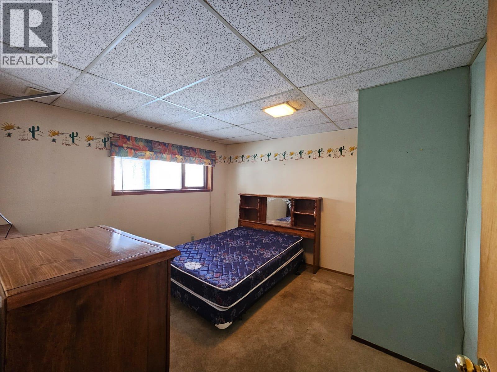 128 Kiskatinaw Crescent, Tumbler Ridge, BC - Indoor Photo Showing Bedroom