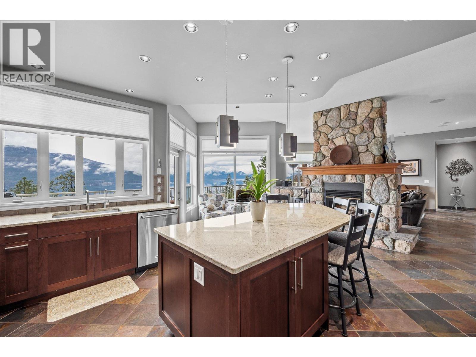 10726 Nighthawk Road Unit# 60, Lake Country, BC - Indoor Photo Showing Kitchen With Fireplace With Upgraded Kitchen