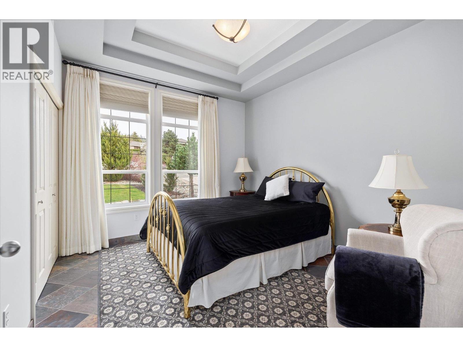 Second bedroom upstairs - 10726 Nighthawk Road Unit# 60, Lake Country, BC - Indoor Photo Showing Bedroom