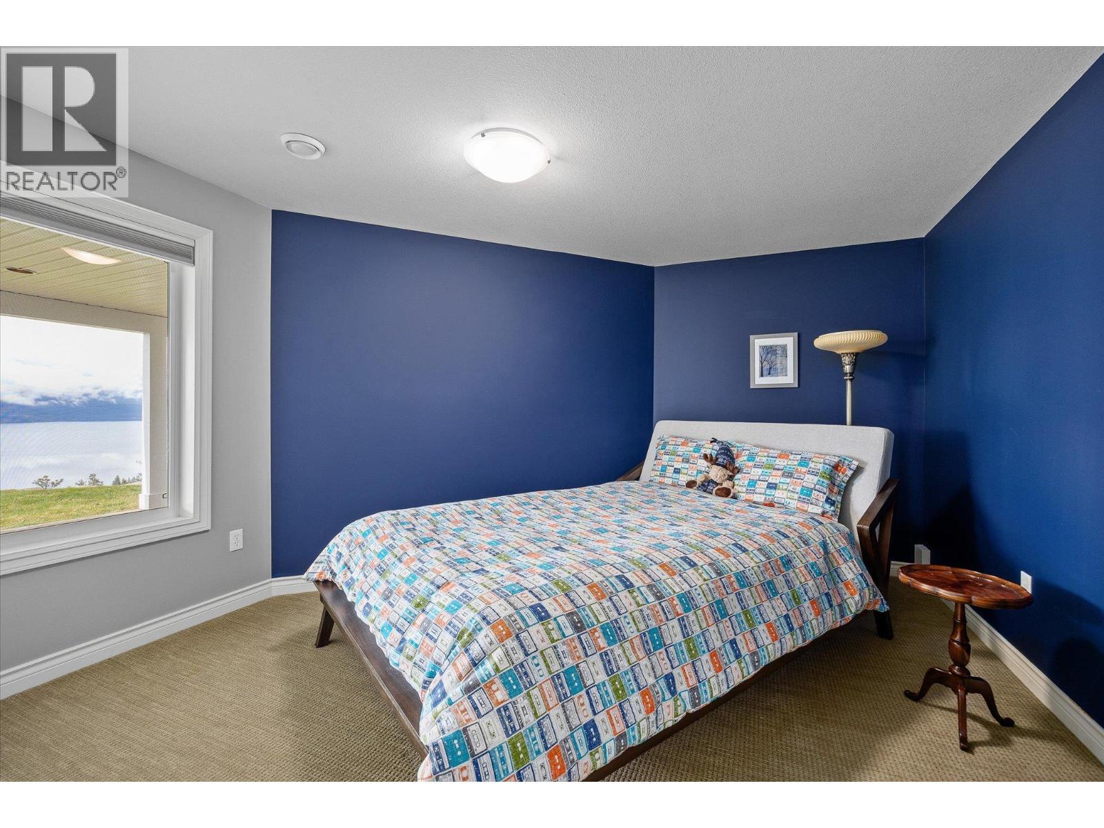 Downstairs Bedroom 1 - 10726 Nighthawk Road Unit# 60, Lake Country, BC - Indoor Photo Showing Bedroom