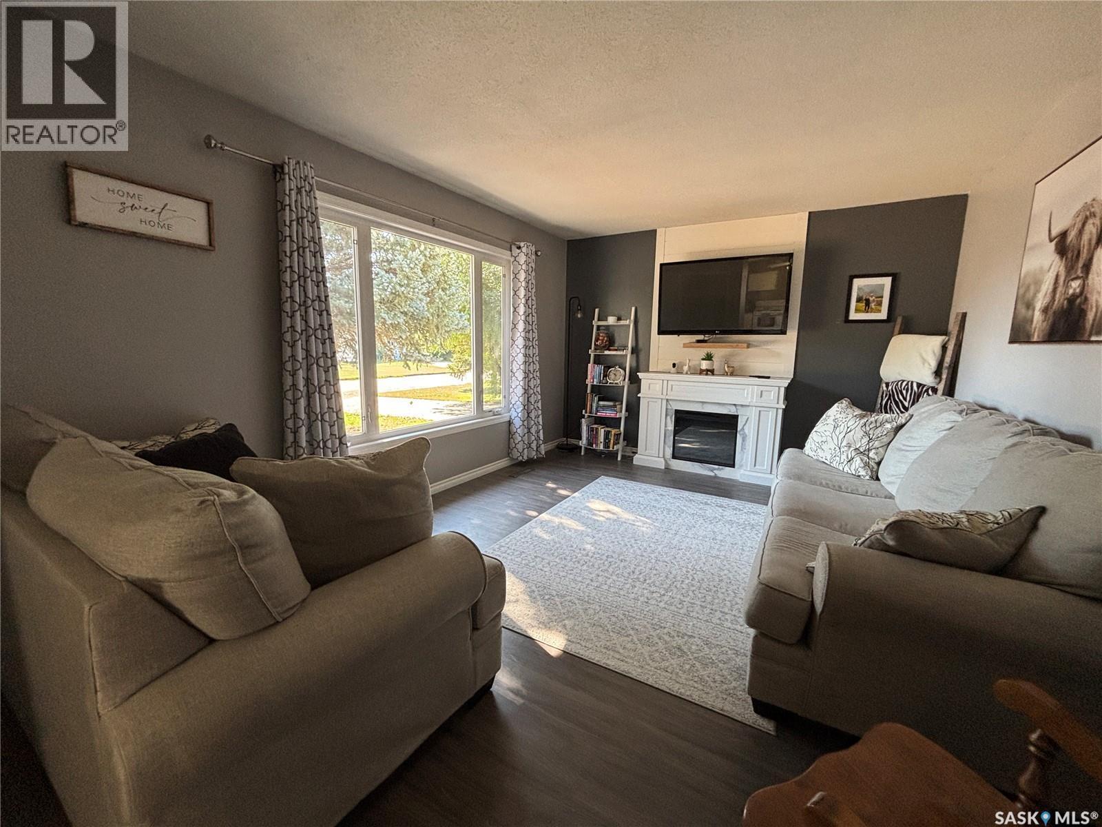 213 Griffin Street, Maple Creek, SK - Indoor Photo Showing Living Room With Fireplace