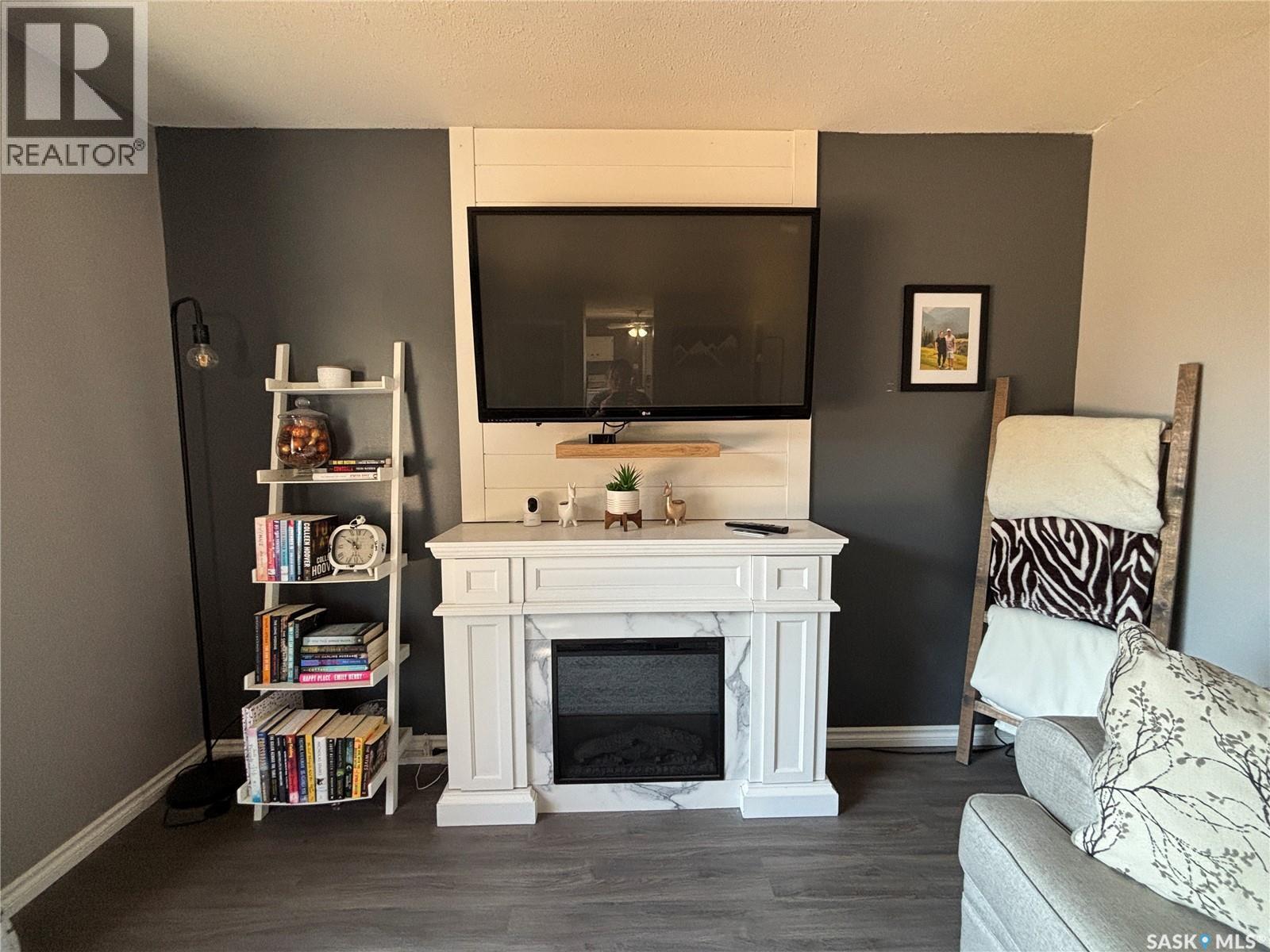 213 Griffin Street, Maple Creek, SK - Indoor Photo Showing Living Room With Fireplace
