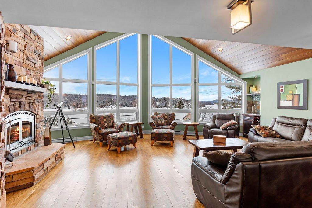 Living room - 48 - 48A Rue Des Trembles, Sainte-Marguerite-Du-Lac-Masson, QC - Indoor Photo Showing Living Room With Fireplace