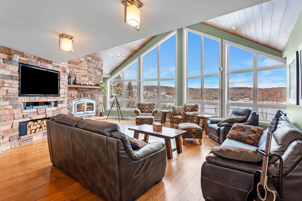 Living room - 48 - 48A Rue Des Trembles, Sainte-Marguerite-Du-Lac-Masson, QC - Indoor Photo Showing Living Room With Fireplace